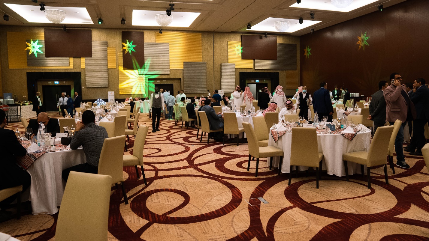 A picture containing text, indoor, ceiling, people

Description automatically generated