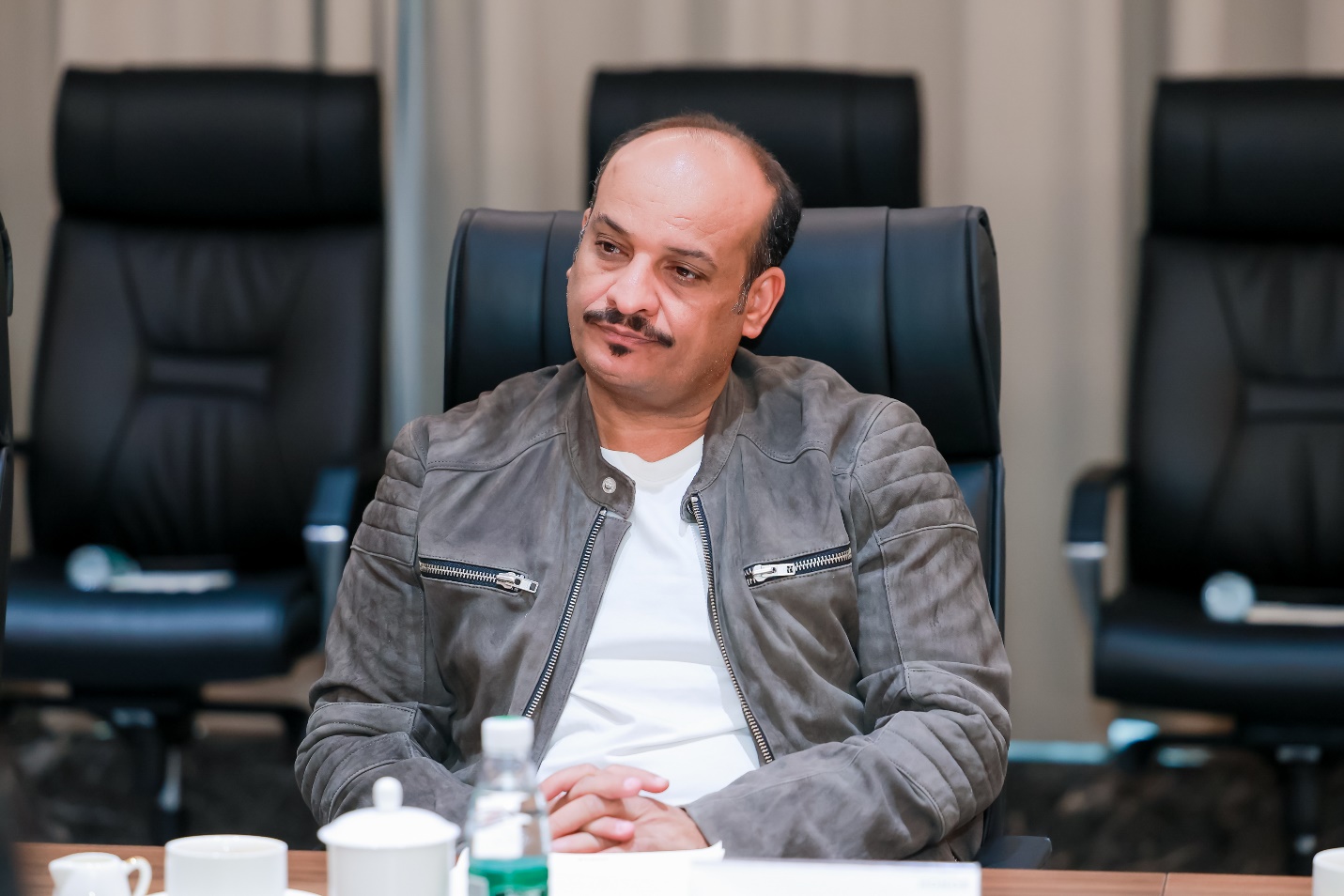 A person sitting in a chair

Description automatically generated