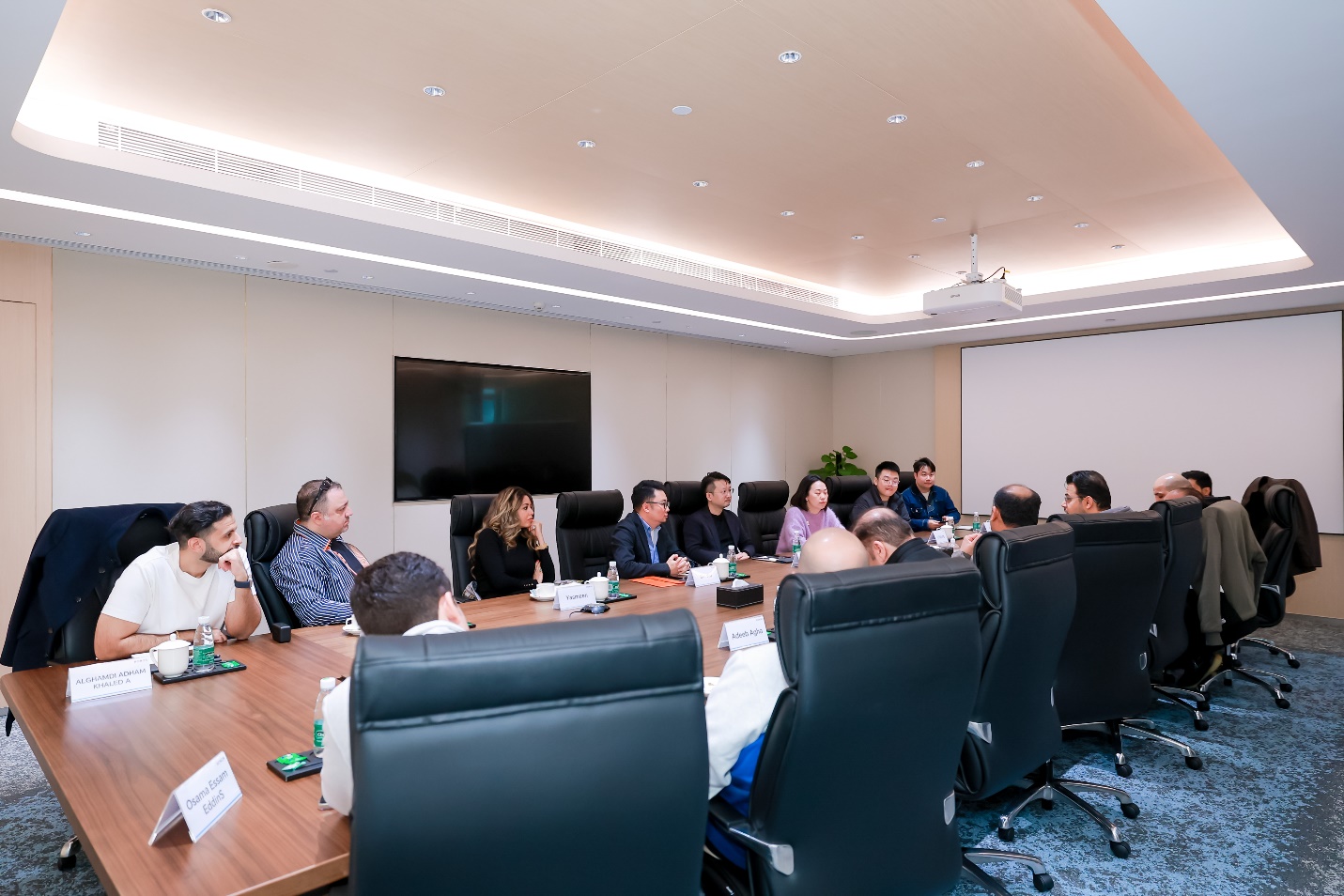 A group of people sitting around a table

Description automatically generated